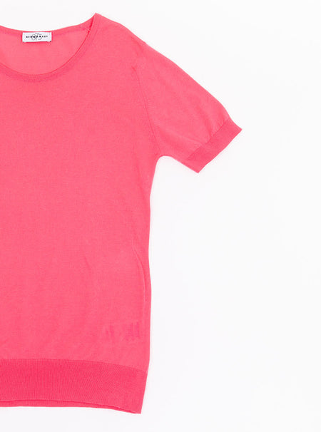 Flat lay of women's flamingo pink short sleeved knit top in a luxury and premium sea island cotton.